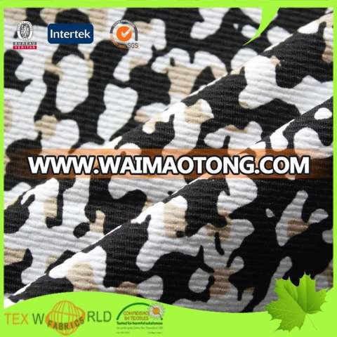 Stretch knitted jacquard moisture wicking cooling fabric